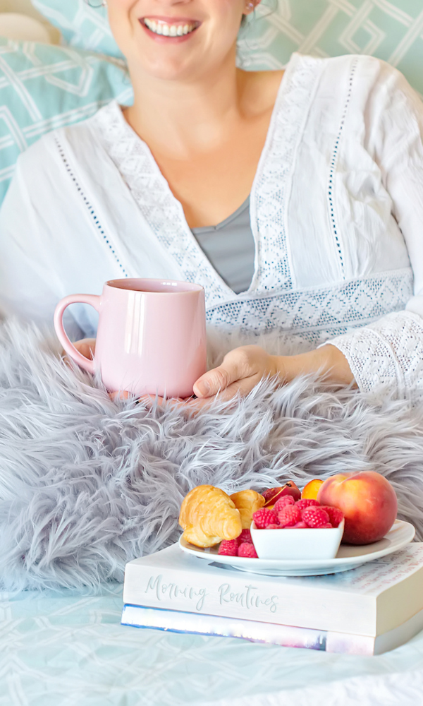 Woman with coffee and fruit